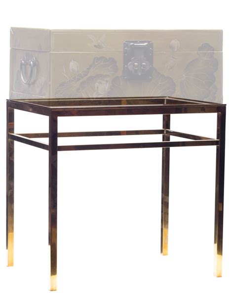 brown leather box on metal stand|Lawrence & Scott Hand.